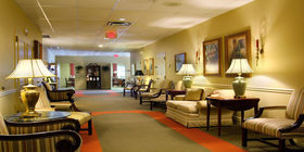 Sitting area in the hallway interior at Royal Palm Funeral Home.