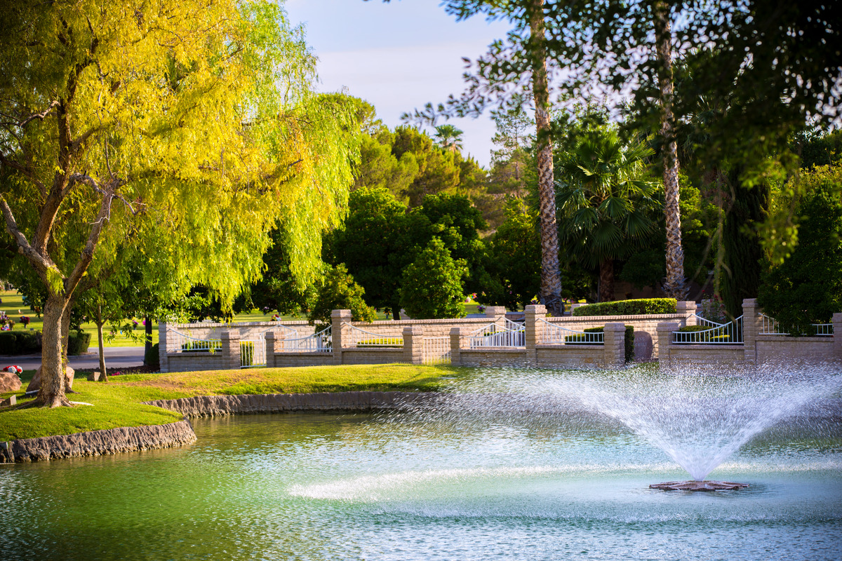 Wide shot of fountain, private gated estates and cemetery grounds outside at Palm in Las Vegas.