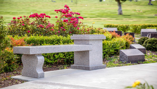 A cremation memorial designed as a bench allows a place for visitors to rest and reflect at Pacific View Memorial Park.