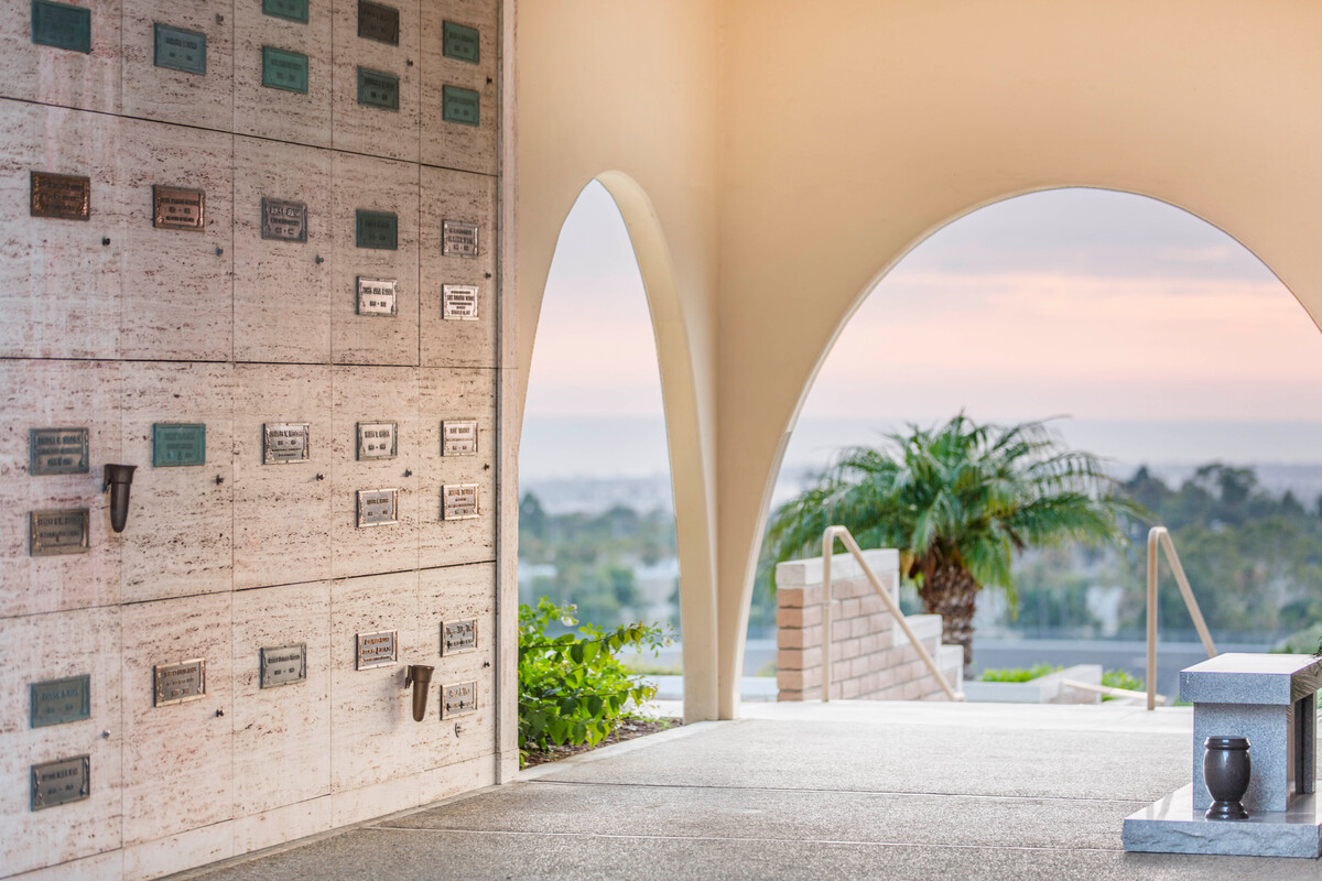Inside a community mausoleum with rounded archways at Pacific View Memorial Park. 
