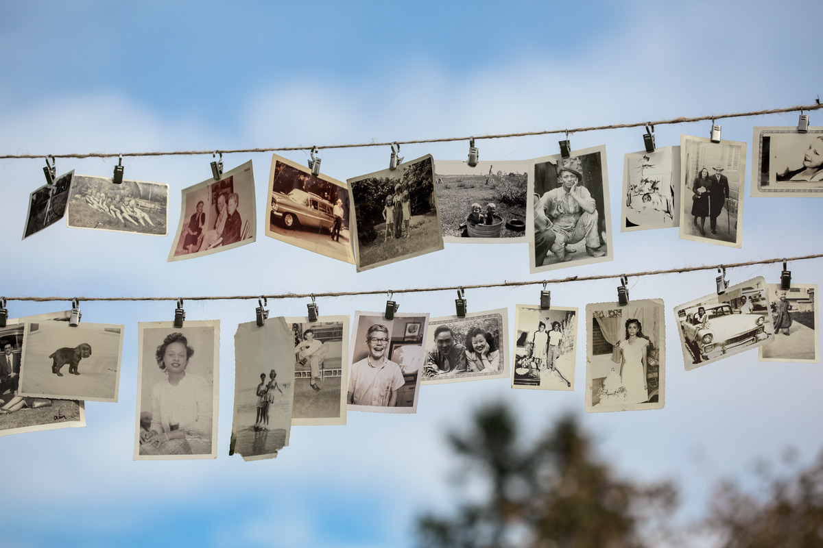 Vintage photographs hand from a clothes-line against a blue sky