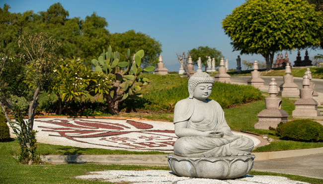 A Buddhist columbarium at Rose Hills Memorial Park, featuring feng shui and lush landscaping.