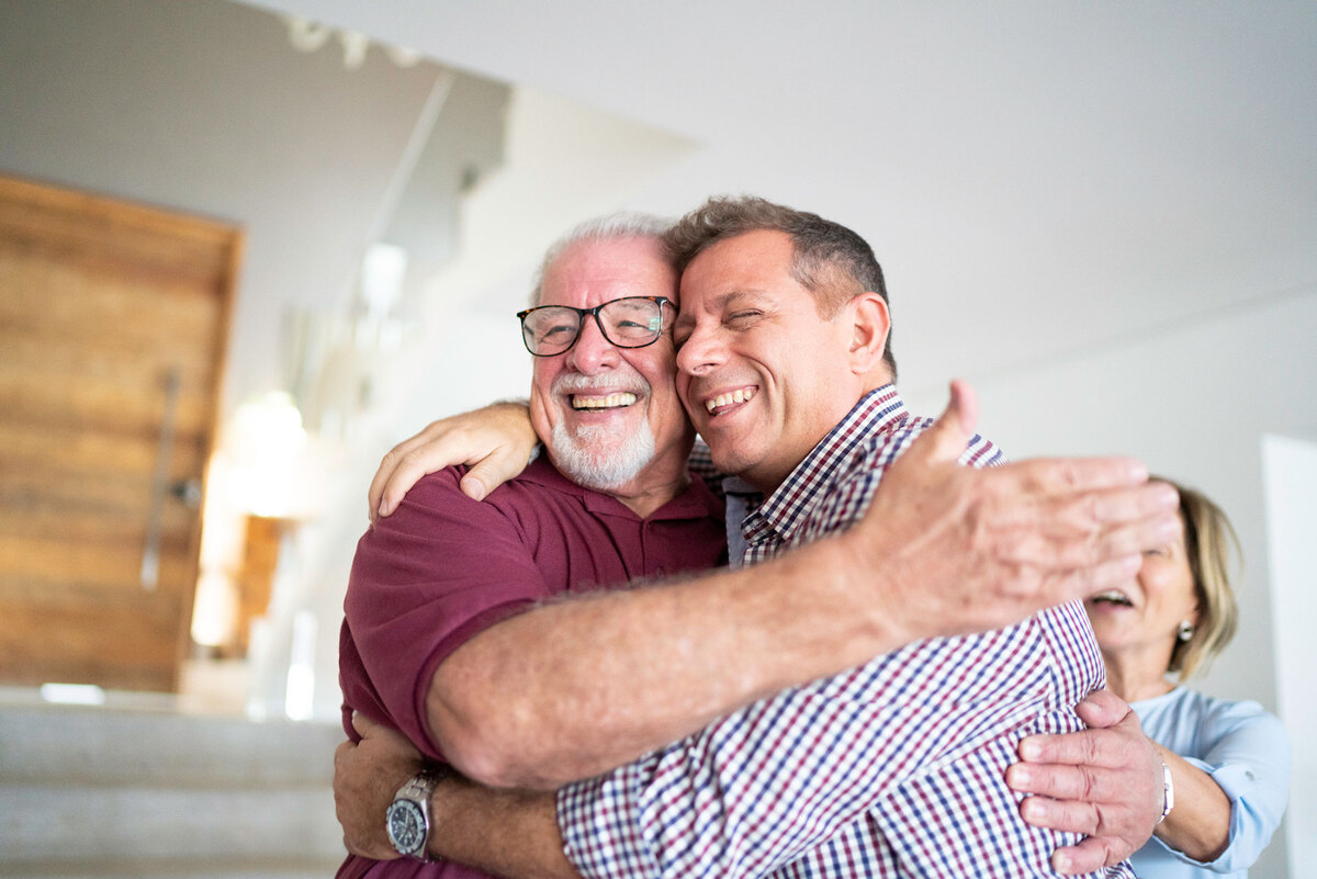 Father and son embracing