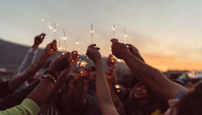 people holding sparklers
