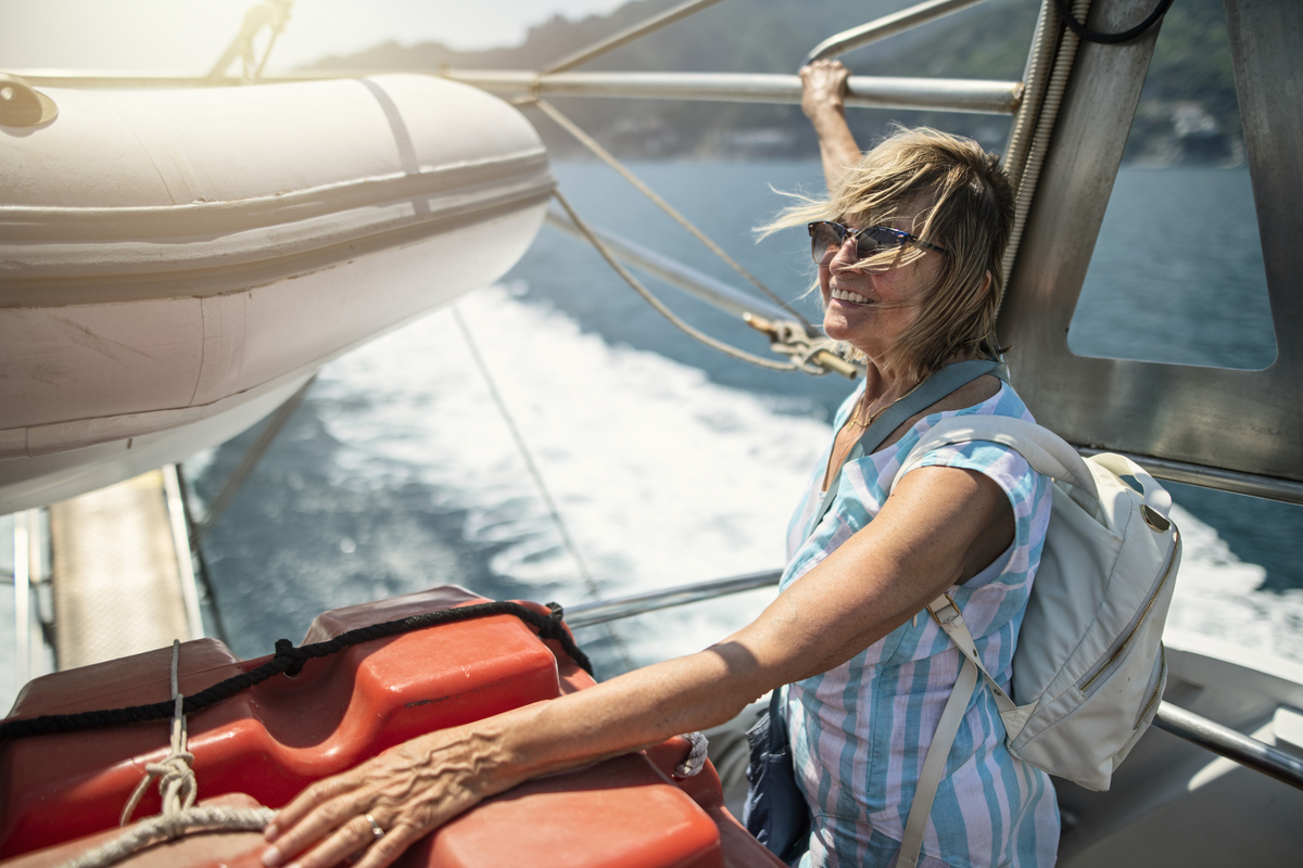 senior woman on boat travelling alone