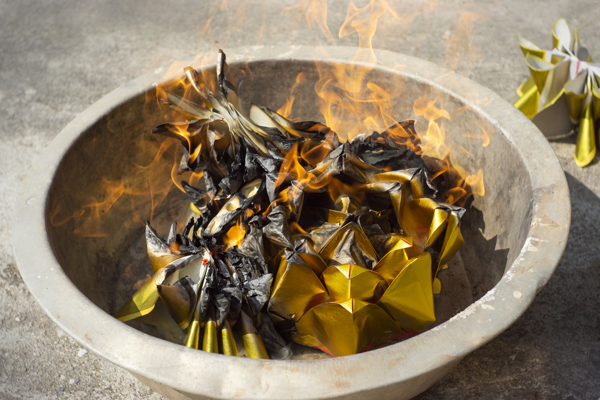 burning joss paper for chinese funeral