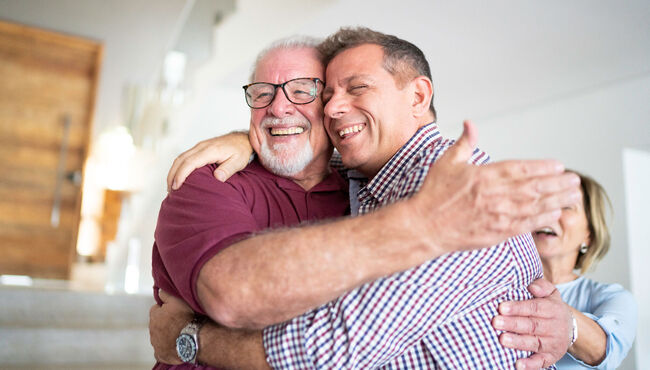 Father and son embracing