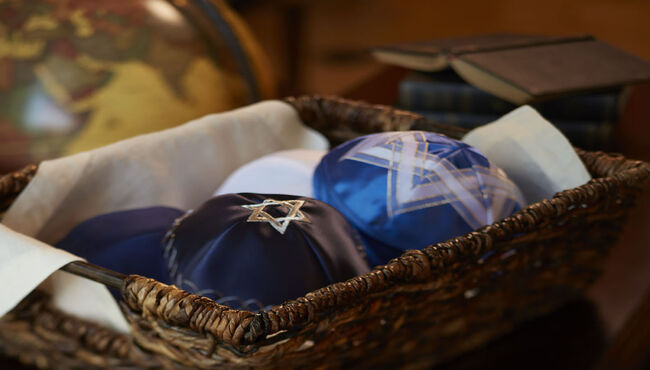 Several Yarmulke's in a basket 