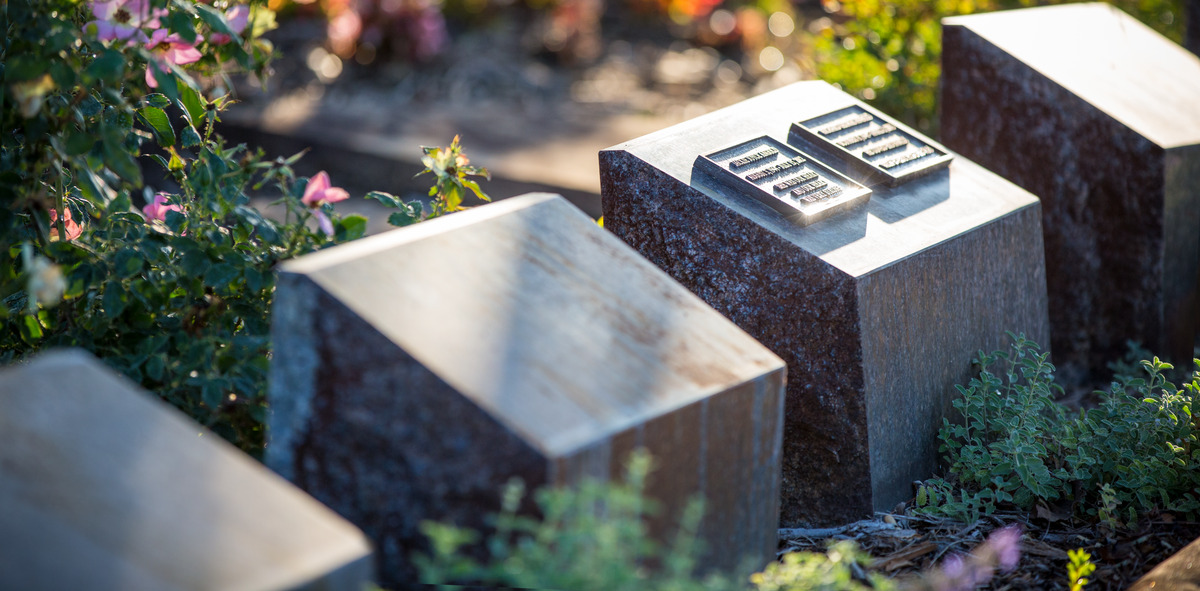 A cremation garden with beveled memorial niches. 