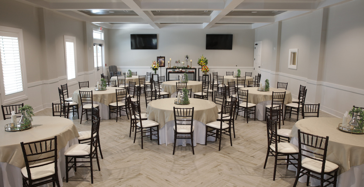Decorated reception room and a beautiful table displaying memorabilia for a celebration of life