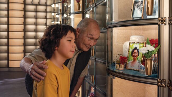 Grandfather and Grandson visiting a loved ones Glass Niche.